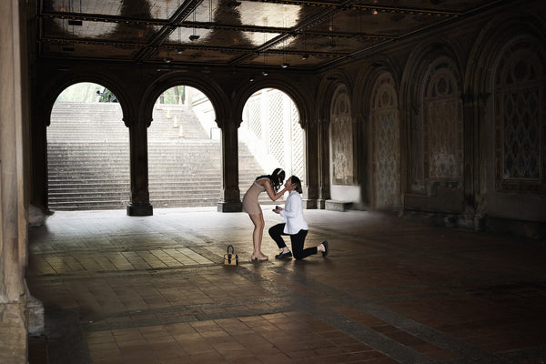 Surprise proposal under the arches of Bethesda Terrace in Central Park, NYC proposal photographer Lena Di