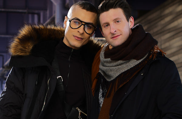 Close portrait of a smiling couple in winter coats and scarves, NYC couples photographer Lena Di