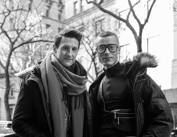 Black and white portrait of a couple in scarves and winter coats on a New York street, NYC couples photography by Lena Di
