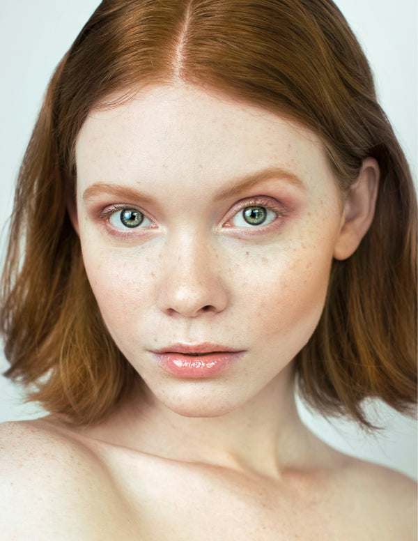 Natural-light beauty portrait of a red-haired woman, NYC portrait photographer Lena Di
