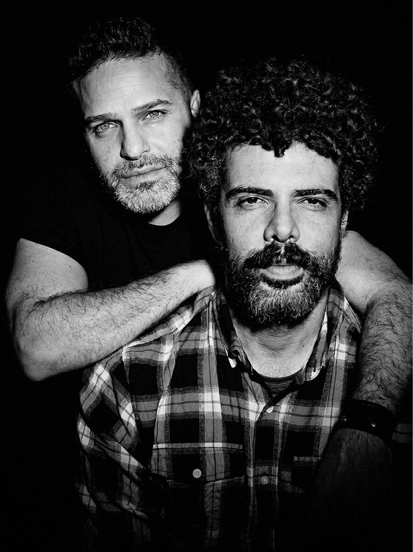Black and white portrait of two men, one with curly hair, editorial portrait photography in New York