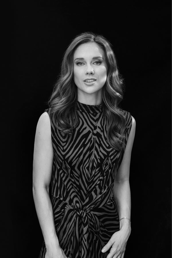 Woman in a black sequined dress on a dark backdrop, glamour portrait by Lena Di NYC