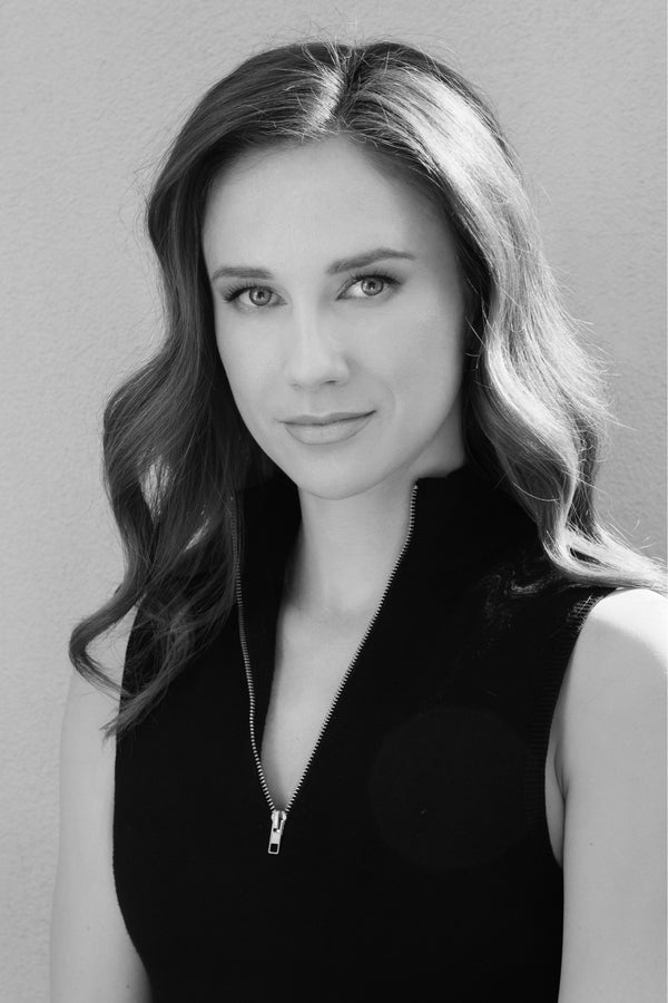 Black and white portrait of a woman with long hair in a black top, NYC headshot and portrait photographer